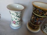 three vases that are sitting next to each other on a table