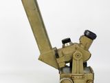 an old brass pipe cutter on a white surface with a white background