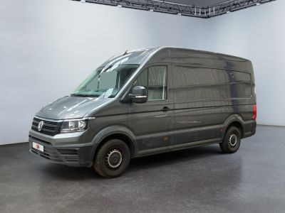 the van is parked in the large room of the building