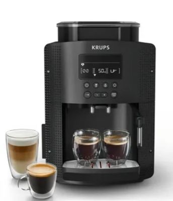 une machine à café noir avec deux tasses de café à côté