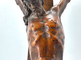a statue of jesus on a cross with a sky background