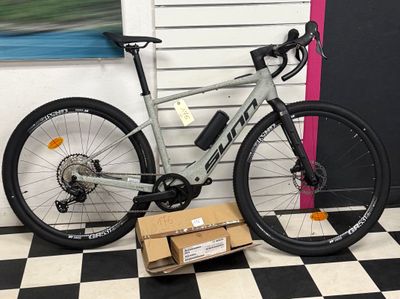 a bike that is sitting on a box on the floor