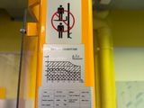 a yellow crane with a no parking sign on it
