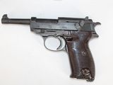 a gun that is on a table with a white background