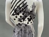 an image of a mannequin wearing a black and white top
