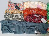 a lot of clothes that are sitting on a table