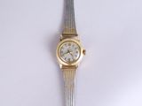 a silver and gold wrist watch on a white surface
