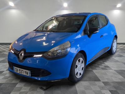 the blue car is parked on a checkered floor in a garage