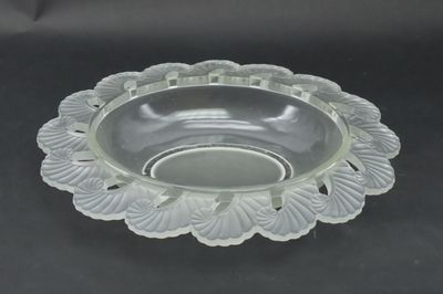 a clear glass bowl with a decorative design on it