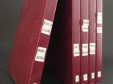 three red binders with labels on them sitting on top of each other
