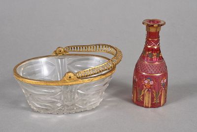 a glass bowl and a glass bottle sitting next to each other