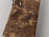 an old book that is sitting on a table