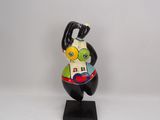 figurine of a man holding a baseball bat on a black base