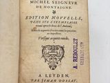 an open book with a picture of a lion on it