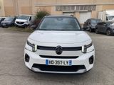 a picture of a white car parked in a parking lot