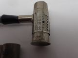 a small metal object that is sitting on a table
