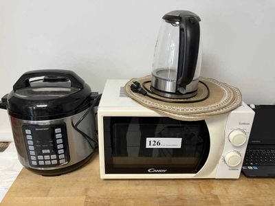 a microwave and a blender sitting on a counter