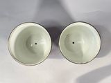 two bowls that are sitting on a table