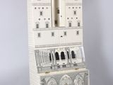 a tall white cabinet with a clock on top of it