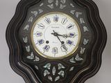 a clock that is hanging on the wall in the room