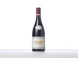 a bottle of red wine sitting on top of a table
