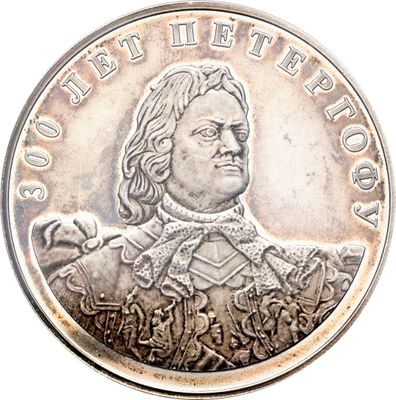 une image représentant une pièce d'argent sur laquelle figure le portrait d'un homme
