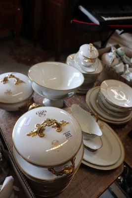 a table with a lot of dishes and bowls on it