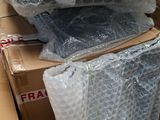 a pile of plastic bags sitting on top of a cardboard box