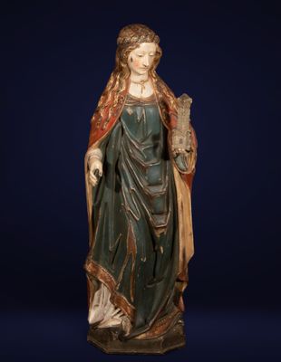 a statue of a woman holding a bird in her hand