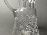 an image of a glass pitcher on a table