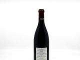 a bottle of wine that is sitting on a table