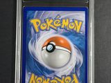 a close up of a pokemon card in a plastic case