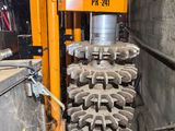 a machine that is working on a large piece of machinery