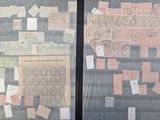 many different stamps on the glass of a window