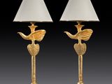a pair of brass table lamps with birds on them