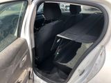 a car that has its door open with the seat up