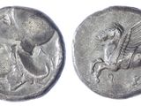 a close up of a coin with a horse and a man on it