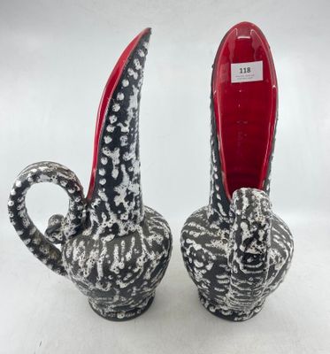 pair of black and white ceramic elephant vases with red feet
