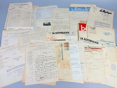 many papers are piled on top of each other on a table