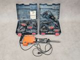 an image of two electric tools in a case on the floor