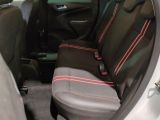 the back seats of a car with red trims are shown