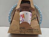 a cardboard box with a cup in it on a table