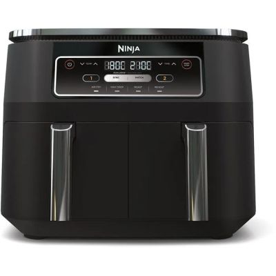 a close up of a black air fryer on a white background
