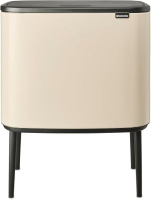 a white and black trash can with a black lid on a white background