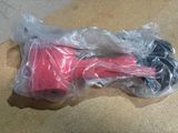 a plastic bag with a pink object inside of it