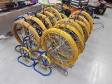 a lot of hoses that are sitting on a rack