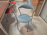 two chairs that are sitting next to a table