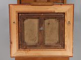 a picture of an old wooden box with a window in it