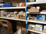 many boxes and boxes on the shelves in the garage