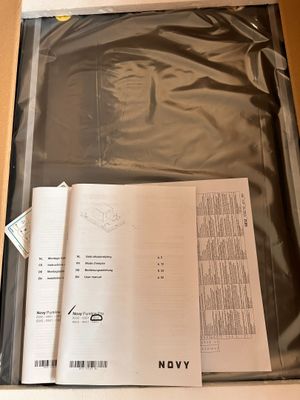 a box with a sheet of paper inside of it